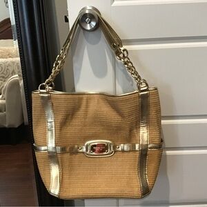 Michael kors jute and gold leather trim tote with gold hardware.